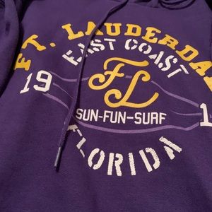 Slightly oversized purple hoodie with graphic